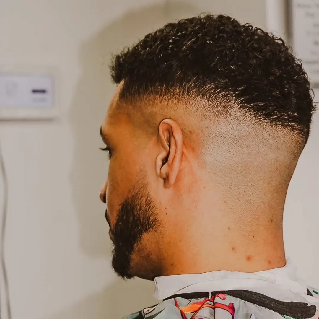Curly top fade with beard lineup at Barberhood Toronto