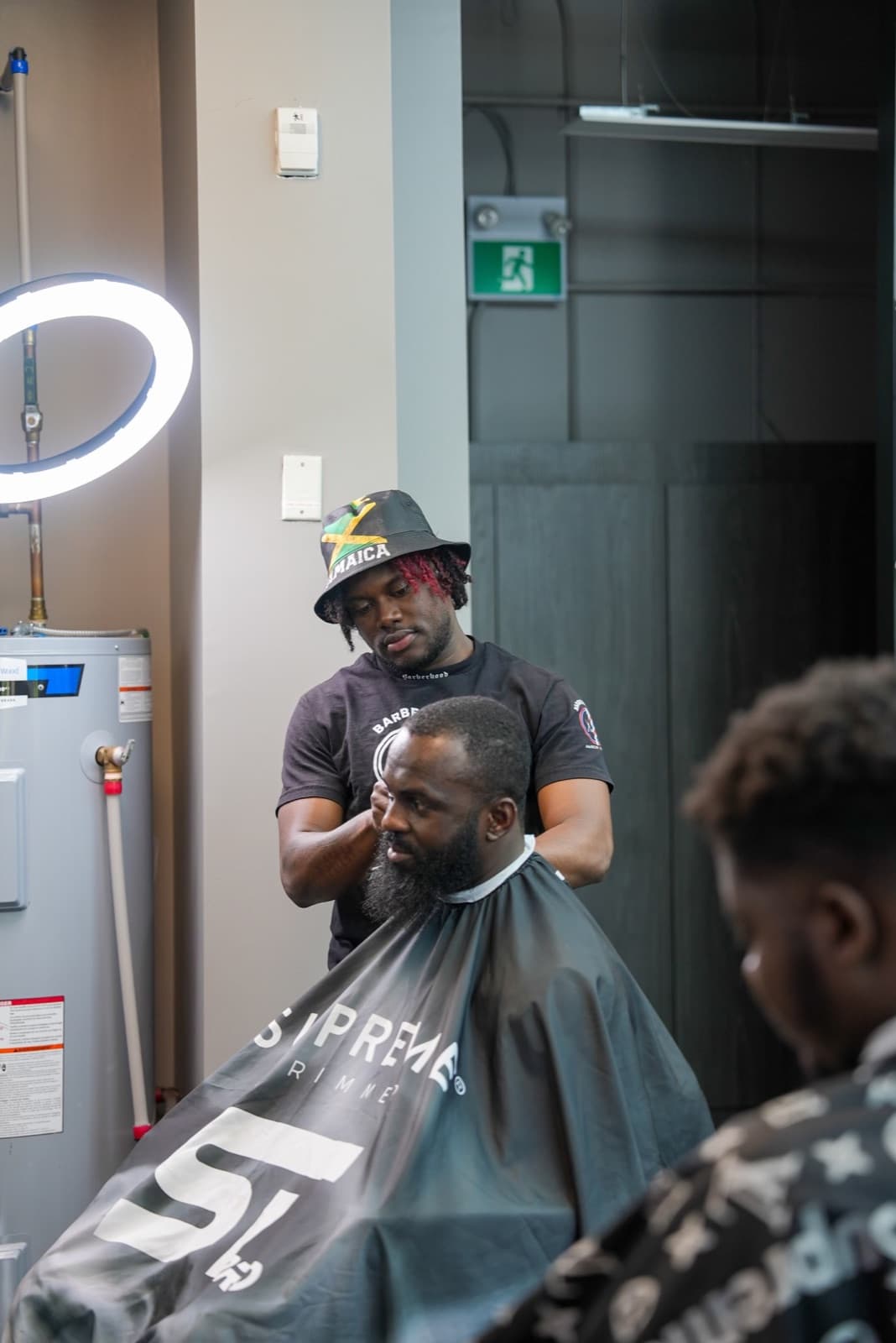 Simba working with a client at Barberhood York U